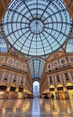 the inside of a large building with a glass ceiling