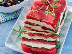 two slices of watermelon and feta cheese on a plate