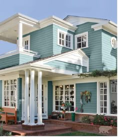 a blue house with white trim and windows