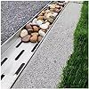 rocks are lined up along the edge of a walkway