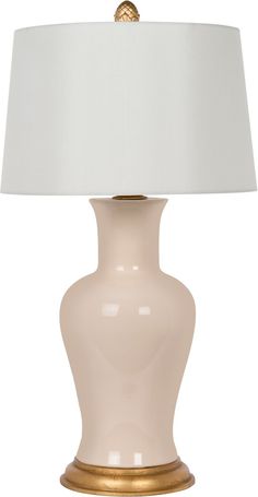 a white lamp with a gold base and a white lampshade on the bottom