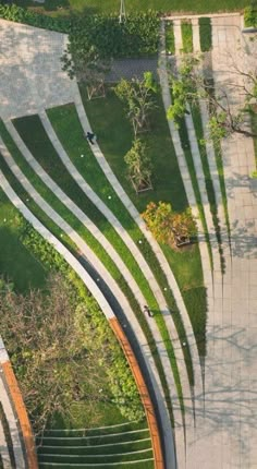 an aerial view of a grassy area with stairs