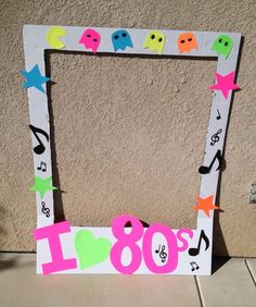 a photo frame decorated with music notes and stars