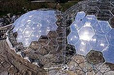 an aerial view of two large domes in the ground