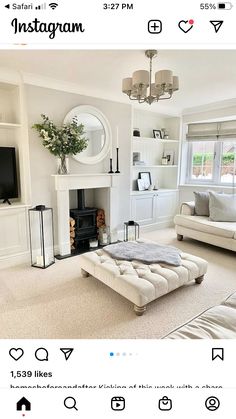 a living room filled with furniture and a fire place in front of a flat screen tv