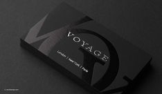 a black business card with the word voyage on it's front and bottom corner