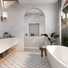 a white bath tub sitting inside of a bathroom