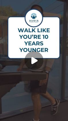 a man walking down a sidewalk next to a window with the words walk like you're 10 years younger