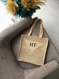 This crocheted raffia tote bag will become your favorite bag. This trendy and stylish crocheted bag has been an absolute favorite for summer for several years now. It can be used for shopping, as a beach bag, city bag. The knitted bag is versatile and goes with any of your looks.  The raffia bag can be made with a triangle or triangle with embroidery. Accentuate your personality with embroidery that I can do for you, only embroidery by my hands.  If you want to teach a bag with embroidery - choose the option with personalization and in the box specify the desired inscription. You can also contact me with messages.  Examples of works can be seen in my Instagram kayana.knit.  The bag is eco friendly and made of natural raffia. The size of the bag is 36x38x3 cm. As this one is handmade, the s Eco-friendly Beige Straw Bag As Gift, Trendy Handwoven Beach Bag For Everyday Use, Trendy Handwoven Everyday Beach Bag, Square Beige Straw Bag For Gift, Beige Bags For Beach Season Gift, Eco-friendly Crochet Tote Beach Bag, Eco-friendly Crochet Beach Tote Bag, Beige Straw Shoulder Bag Gift, Beige Rectangular Beach Bag As A Gift