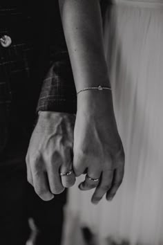 black and white photo of couple holding hands