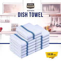 a stack of white towels sitting on top of a kitchen counter