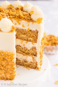 a close up of a cake on a plate with one slice missing from the cake