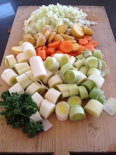 chopped up vegetables are on a cutting board