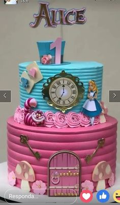 a pink and blue cake with a clock on top that reads 1, 2, 3, 4