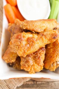 fried chicken with carrots and celery sticks