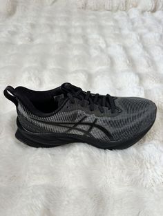 Step up your running game with these ASICS Novablast 3 LE sneakers. Designed with a low top shoe shaft style and lace-up closure, they provide a comfortable and secure fit during your outdoor or city runs. The black mesh upper material offers breathability and durability, while the foam insole material ensures a cushioned feel with every stride. These athletic sneakers are perfect for activewear or casual occasions, and with their classic and sports-themed design, they're sure to become a favorite in your shoe collection. Make them yours today, and experience the exceptional performance and activity they provide. Asics Low-top Mesh Sneakers, Asics Running Shoes With Cushioned Midsole For Streetwear, Asics Mesh Sneakers For Jogging, Asics Low-top Sneakers With Air Cushioning, Asics Dynamic Sneakers With Air Cushioning, Asics Sneakers With Air Cushioning, Asics Sneakers With Laces For Jogging, Asics Sneakers For Jogging With Branded Insole, Dynamic Asics Sneakers For Jogging