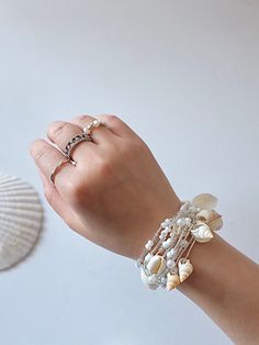 Made to order 100% DEEP Ocean shells and conch  100% Natural Shinny Pearls. A chain is made of High Quality elastic strings, PLS DO NOT PULL UP TOO HEAVILY!! NO WORRIES, We've tested for more than 50 times to pull up and down. looks LUXURY and SUPER CUTE. White Oyster Bracelet Jewelry For The Beach, Beaded Silver Strand Jewelry, Bohemian Shell Jewelry For Wedding, Pearl White Shell Jewelry For Beach, Silver Beaded Jewelry For Beach Wedding, White Shell Beaded Bracelets As Gift, Pearl White Beaded Jewelry For Beach, Silver Jewelry With Pearl Charm For Beach, Pearl White Beaded Jewelry For The Beach