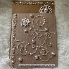 a card with pearls and lace on it