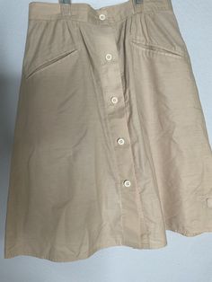 Geoffrey Beene Sport Tan A-line Knee Length Button Skirt Women's Size Small Geoffrey Beene Sport Tan A-line Knee Length Button Skirt Women's Size Small.  With nice front pockets. In very good vintage condition. No size Meas est 29-30" waist, 23" length. It fits me and I can be a small to -XS depending on brands. This is an adorable skirt.50%cotton 50% polyester. Geoffrey Beene, Button Skirt, Knee Length, Art Collection, Womens Skirt, A Line, Bathing Beauties, Display Homes, Womens Sizes