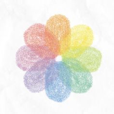 an image of a rainbow colored flower on white paper