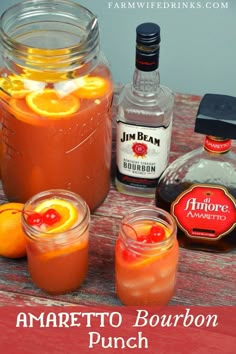 an image of some drinks on a table with oranges and rum in the background