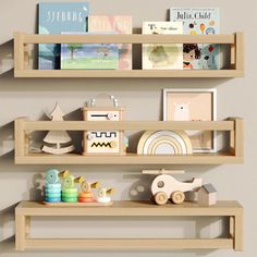 three wooden shelves with books and toys on them