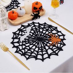 the table is decorated with black spider webs