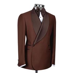 Package Includes: 1 x Jacket - 1 x Pant

Introducing the Chocolate Brown Tuxedo, a masterpiece of sophistication and style. Crafted from premium 120s fabric, this tuxedo combines luxury and comfort, perfect for any formal occasion. The double-breasted design with two buttons exudes timeless elegance, while the dark brown shawl lapel adds a refined touch. Whether you're attending a wedding, gala, or any high-profile event.

 	Fabric: 120s 
 	Lining Fabric: Silk
 	Pattern: Plain
 	Buttons: Fabric
 	Construction: Half Canvas
 	Seasonality: All Season
 	Jacket: Dark Brown Shawl Lapel, 3 Straight Pockets, Double Breasted With 2 Buttons
 	Trouser: Flat front, 2 Back Pockets, Zip Closure Brown Tuxedo, Brown Shawl, Male Clothing, Silk Pattern, Custom Chocolate, Tuxedo Wedding, Elegant Man, Fabric Silk, Formal Wedding