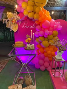 balloons and cake are on display at a party