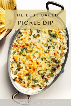 the best baked pickle dip recipe in a skillet with chips on the side