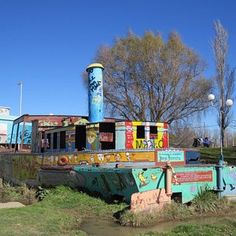 an old boat that has been turned into a playground for the kids to play on