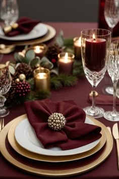 the table is set with red napkins and place settings