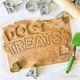 the word docc treats spelled out in sand next to tools and other crafting supplies