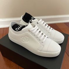 Brand New In Box, 100% Authentic Chanel Leather And Rubber Low Top Tennis Sneakers/Trainers G32719, In White, Women’s Eu Size 38 (Fits A U.S. 7-8). In Giftable Condition. Comes With Complete Original Packaging. Never Worn. Designer Calf Leather Slip-on Sneakers, Chanel Tennis Shoes, Chanel Trainers, Lux Life, Rubber Sneakers, Chanel #1, Chanel Sneakers, Tennis Sneakers, Rubber Shoes