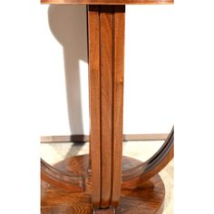 a wooden table sitting on top of a hard wood floor