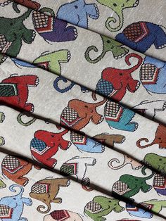 four different patterns of elephants on white fabric