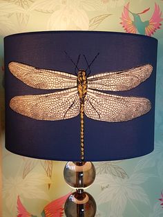 a lamp that has a dragonfly on it