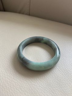 "🌈 Jade Bangle 57.3mm (2.26\"), Round Shape, Green and Smoky Gray 🌷 Untreated Natural Jadeite/ Grade A Jade/ Certified 🌷 Jade from Myanmar/ Burma 🌷 100% handmade carving 🌷 Inner diameter : 57.3 / 2.26\" 🌷 Shape : Round 🌷 Color : Green and Smoky Gray 🌷 Free standard shipping from Hong Kong with tracking included 🌷 Take approximately 7-21 days to arrive worldwide ❤️ In Chinese Culture: Young people wear jade pendant will have a prosperous life, attracts good luck and friendship Old people Spiritual Carved Round Bracelets, Spiritual Round Carved Bracelets, Carved Jade Round Bracelets, Carved Jade Bracelets, Vintage Jade Round Bracelets, Vintage Round Jade Bracelets, Formal Jade Bangle Bracelet, Vintage Jade Bracelets, Green Carved Round Bangle