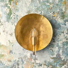 a brass plate with a candle on it