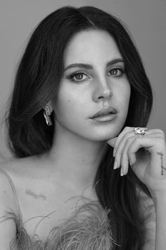 a black and white photo of a woman with long hair