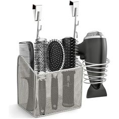 a hair dryer and combs in a holder on a white background with clippings