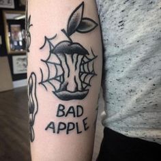 a person with a tattoo on their arm that says bad apple