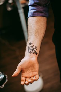 a person with a tattoo on their arm