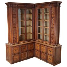 an old wooden china cabinet with glass doors