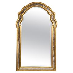 an ornate gold framed mirror against a white background with the reflection of it's own image