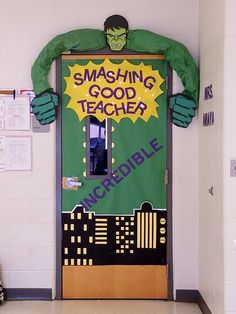 a classroom door decorated to look like the incredible spiderman from the movie, smashing good teacher