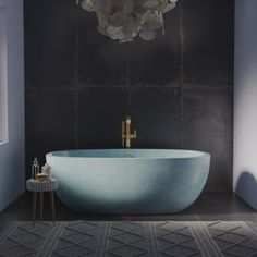 a bathroom with a large blue bath tub