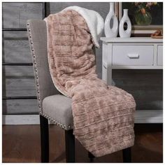 a chair with a blanket on top of it