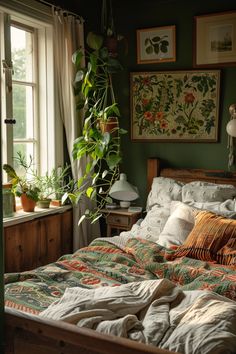 a bed in a room with plants on the wall and pictures hanging above it's headboard