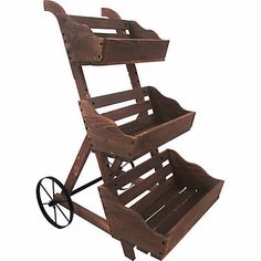 a small wooden cart with wheels on the front and back sides, made out of wood